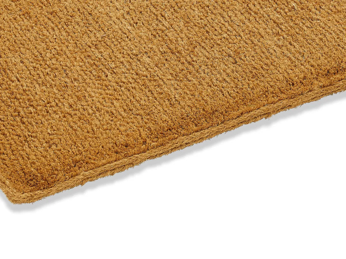 The rope-bound edge and deep pile of the 2 inch mat